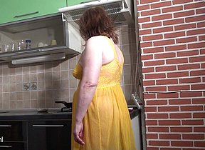 Naughty housewife getting frisky in the kitchen